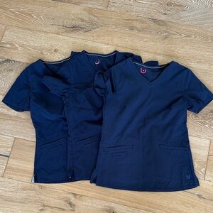 Navy Urbane Performance Scrubs at of 3 tops